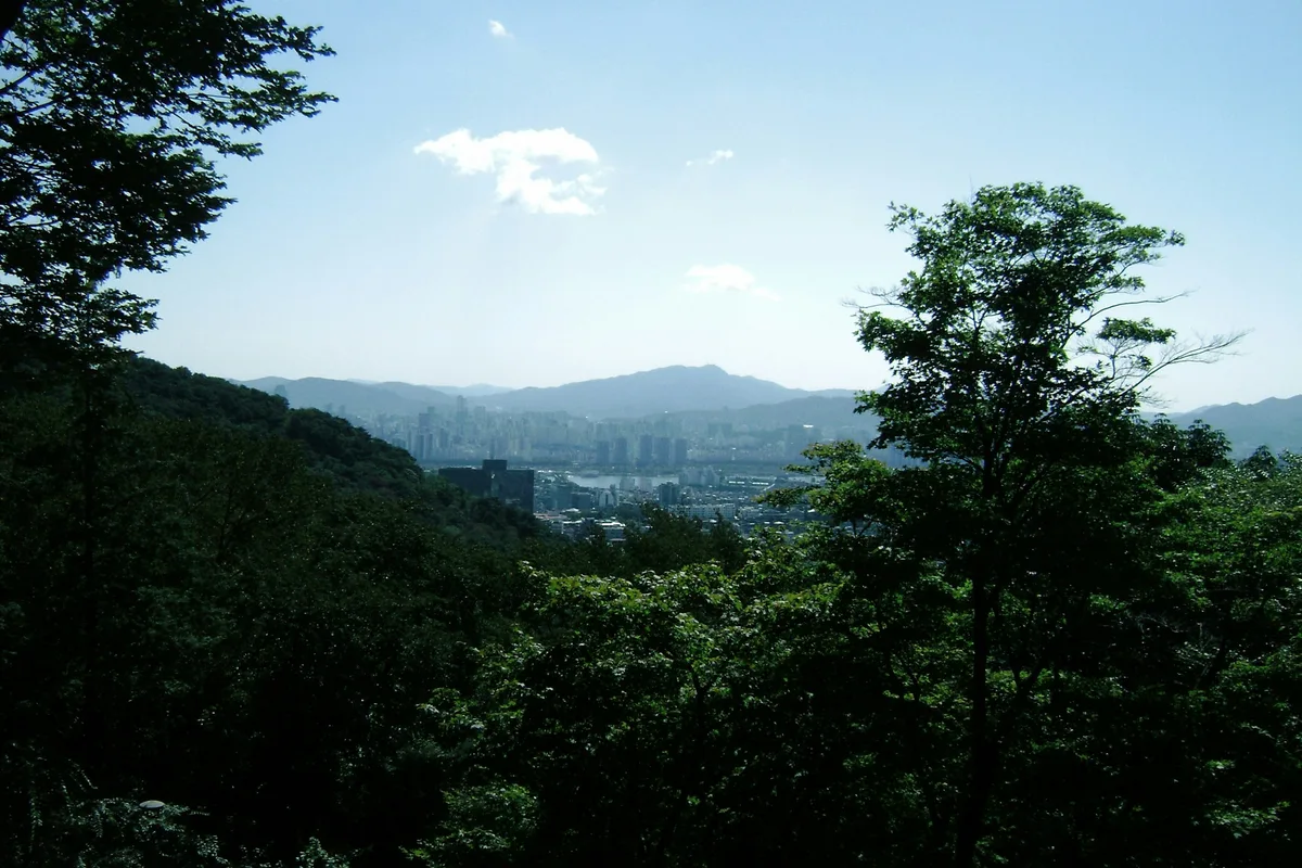 Hiking in Seoul mountain trail city view