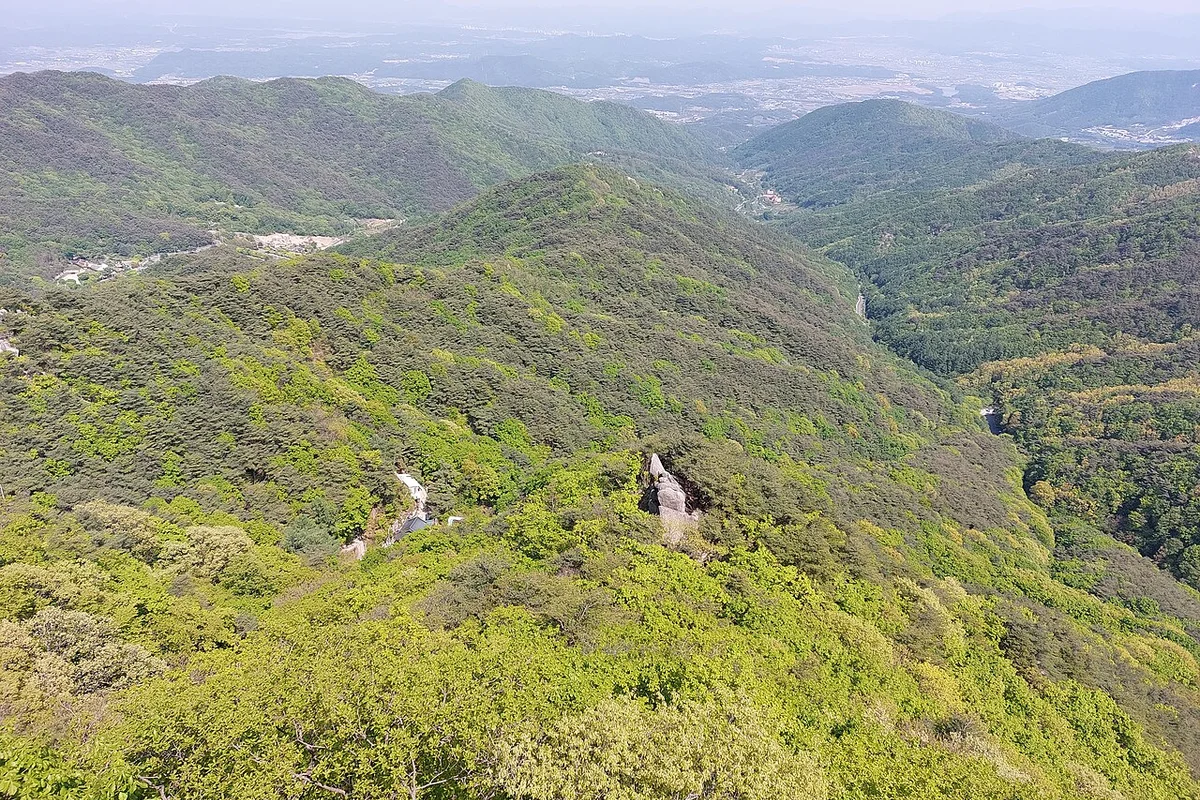Palgongsan ridge trail granite peaks Nakdong River basin view